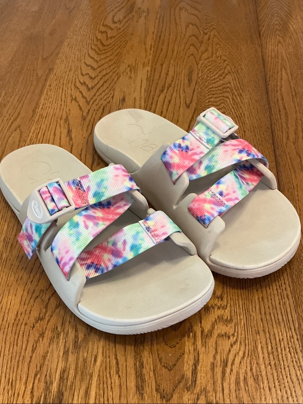 Woman’s Chaco tan w/multi colored strap slide. Size 9. Adjustable strap.Like new